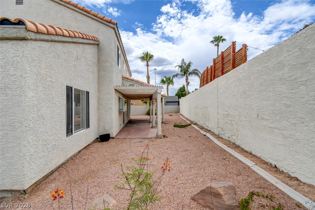 5 Tarryall Terrace Henderson, NV 89074 - Photo 41 of 44 A terracotta-tiled roof crowns this stucco home, offering a shaded patio area for outdoor enjoyment.