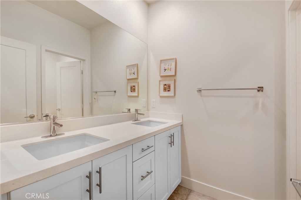 181 Novel Irvine, CA 92618 - Photo 19 of 22 a bathroom with a sink and a mirror