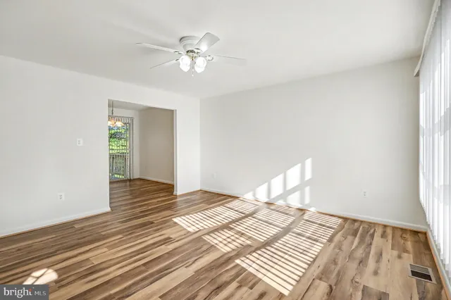 a view of a bedroom with wooden floor and closet