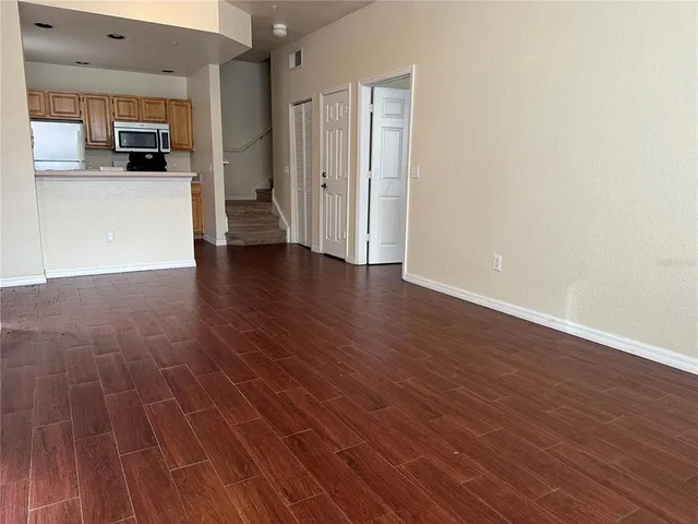 a view of kitchen with furniture and wooden floor