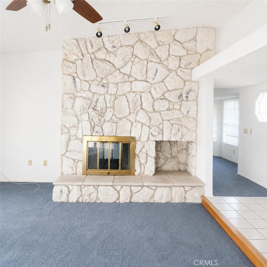 4752 Flying H Road Twentynine Palms, CA 92277 - Photo 17 of 55 a living room with a couch and a fireplace