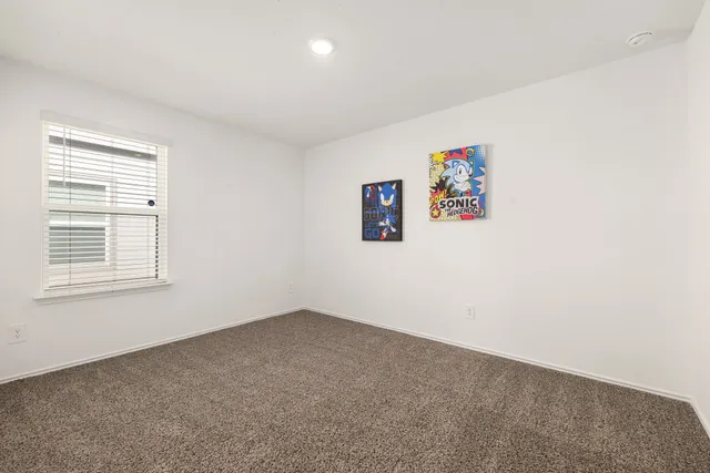 an empty room with closet area
