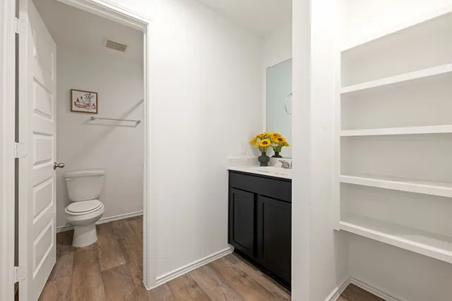 an empty room with a window and wall painting