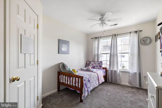 a bed room with a bed and a window