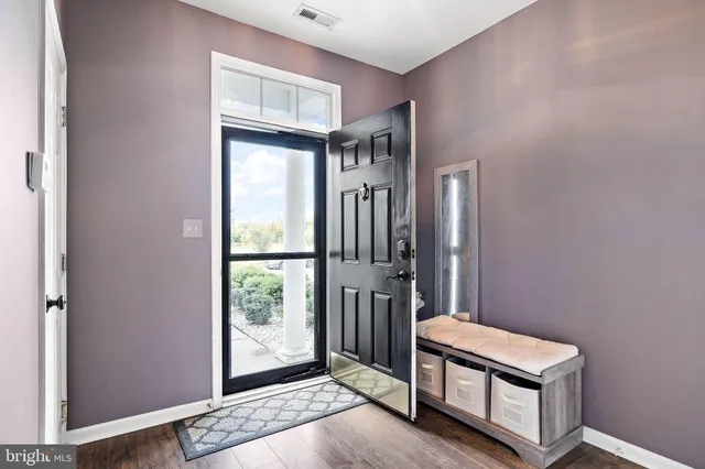 a view of front door with a door and a window