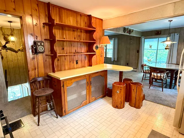 a view of a chairs and table in a patio