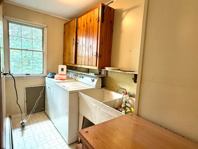 a utility room with dryer and washer