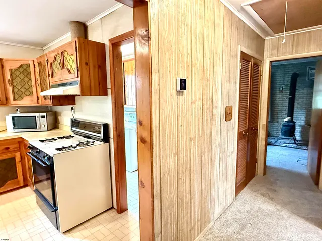 a kitchen with a stove and a refrigerator