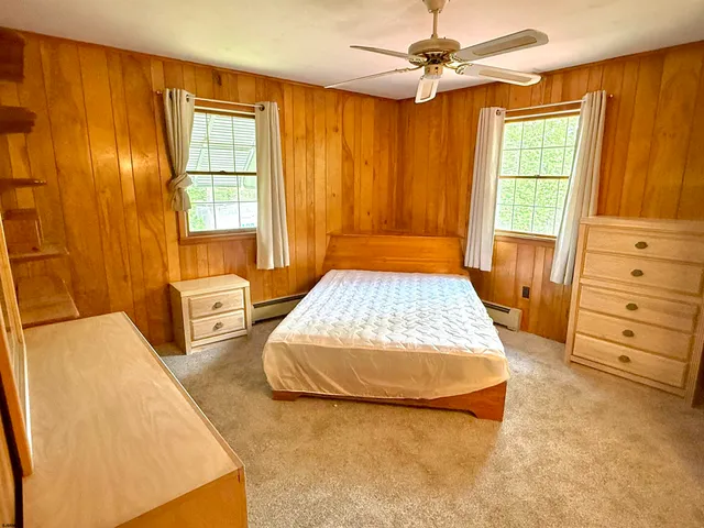 a bedroom with a bed and a table