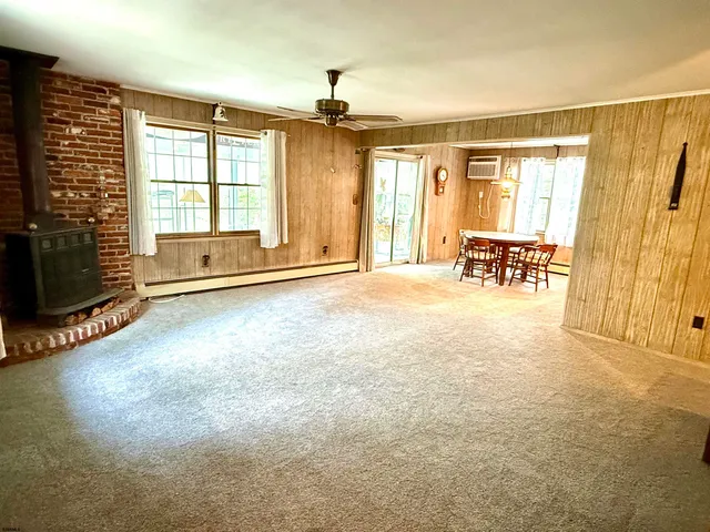 a view of livingroom with hardwood floor and a ceiling fan