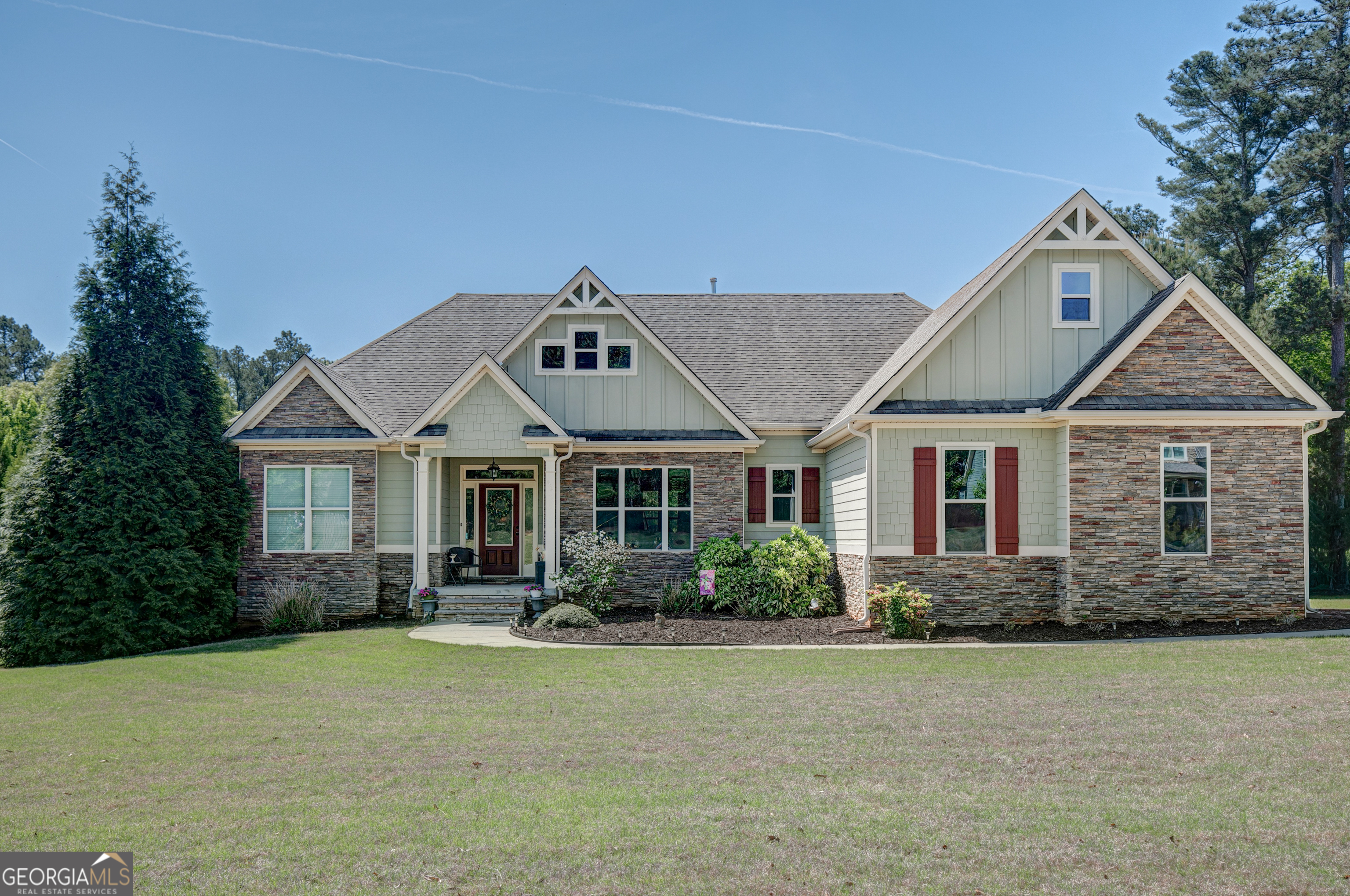 a front view of a house with garden