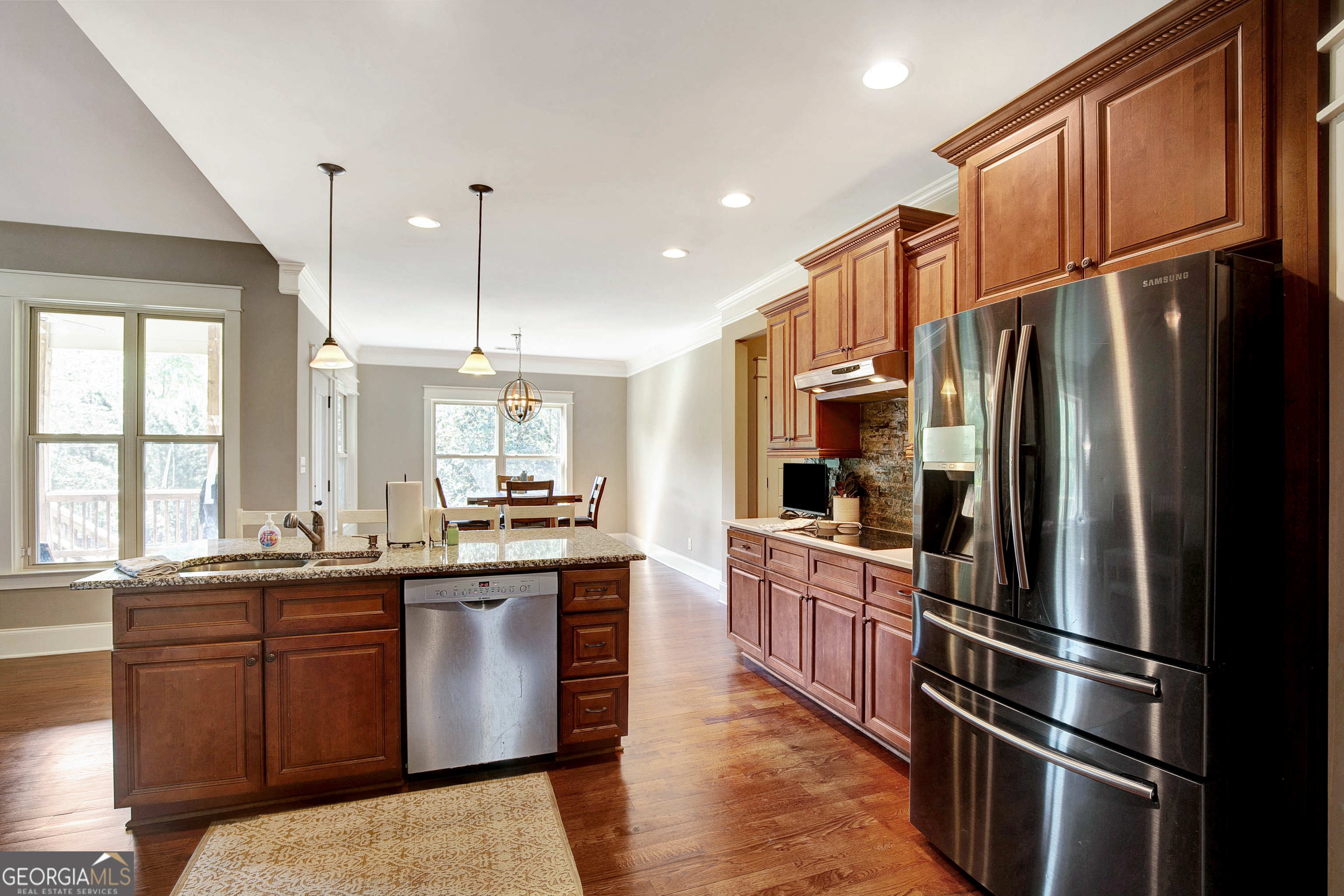 137 Kenmare Row Tyrone, GA 30290 - Photo 19 of 54 a kitchen with stainless steel appliances granite countertop a refrigerator a sink a stove and a refrigerator