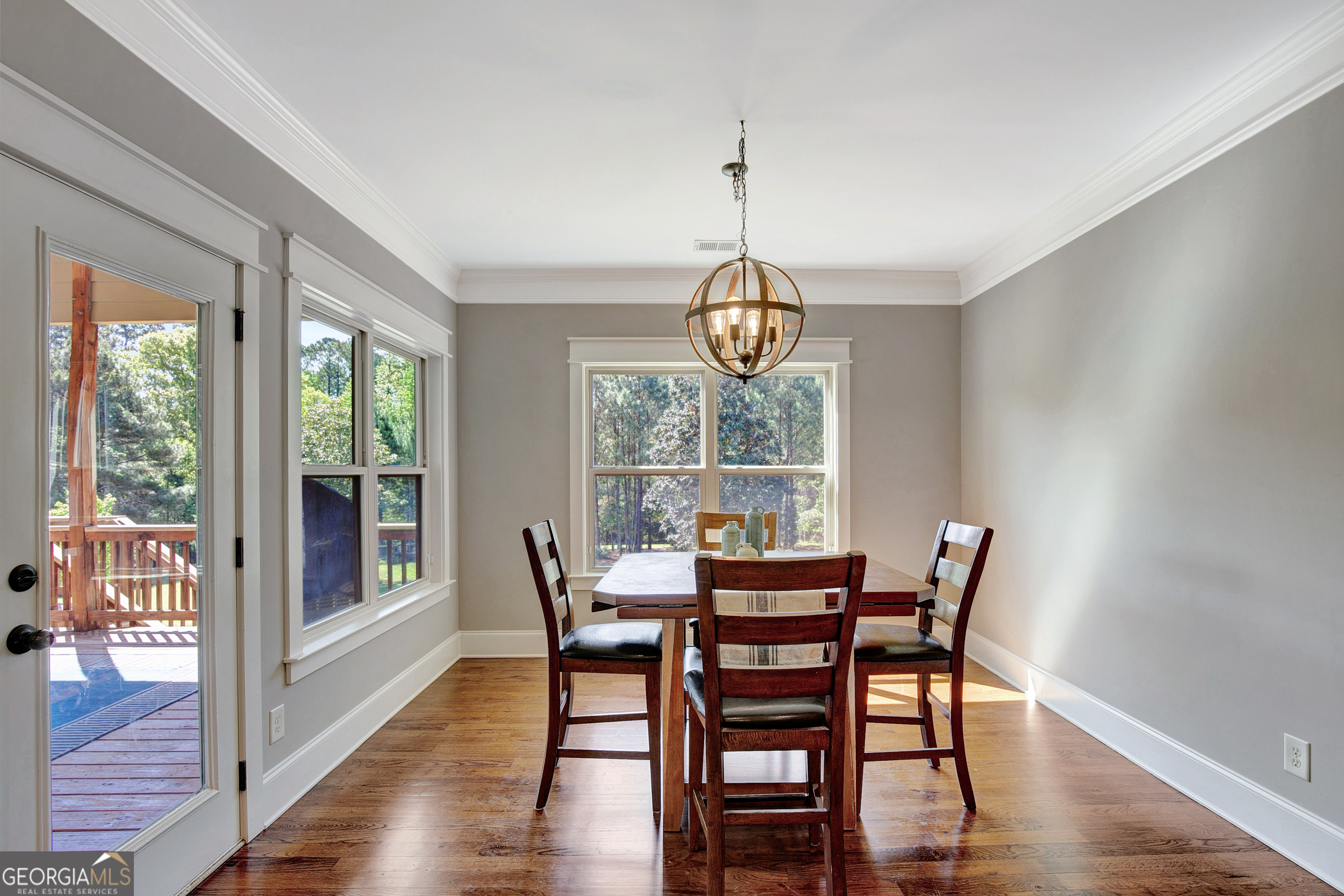 137 Kenmare Row Tyrone, GA 30290 - Photo 22 of 54 a view of a dining room with furniture window and wooden floor