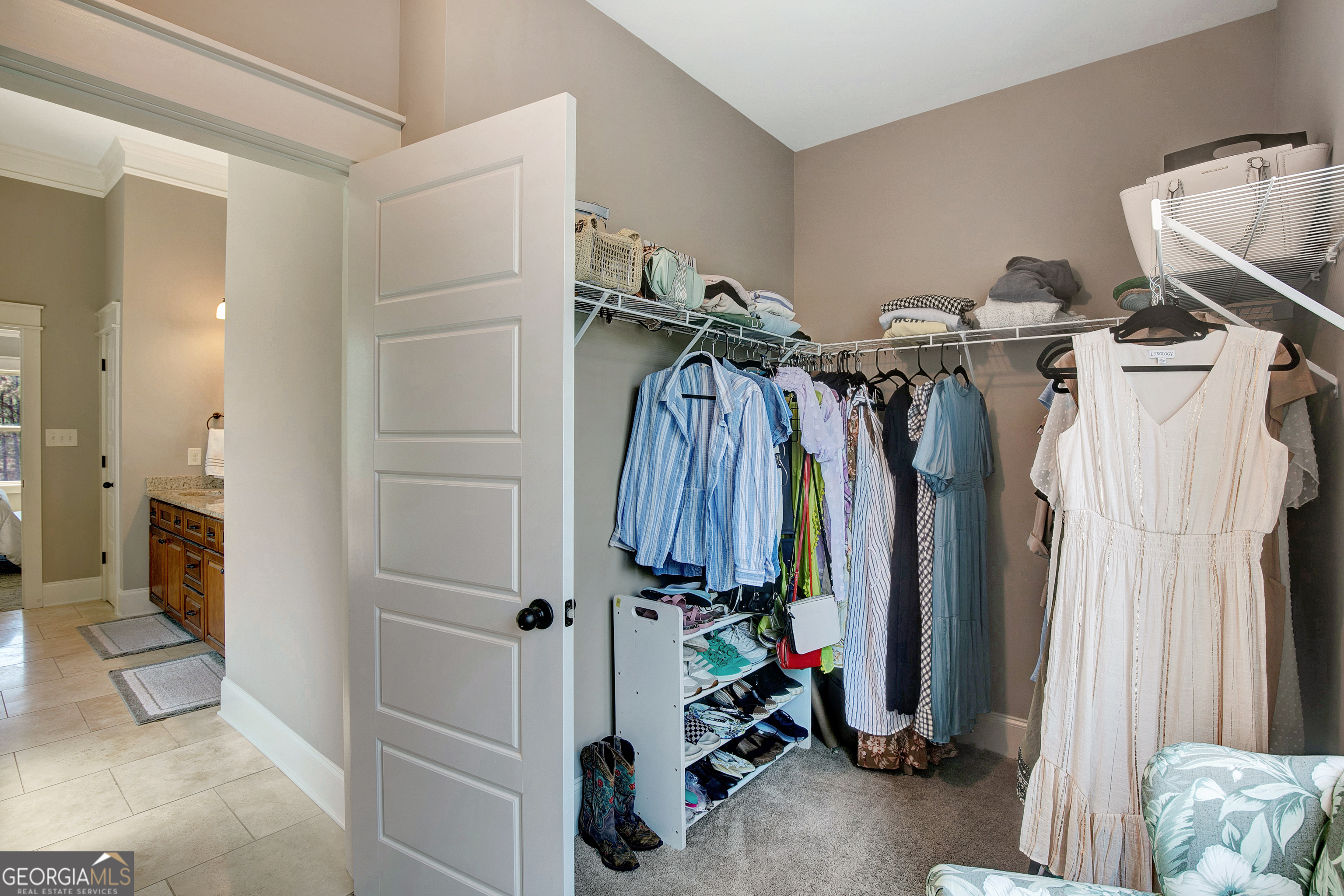 137 Kenmare Row Tyrone, GA 30290 - Photo 30 of 54 a view of walk in closet with clothes