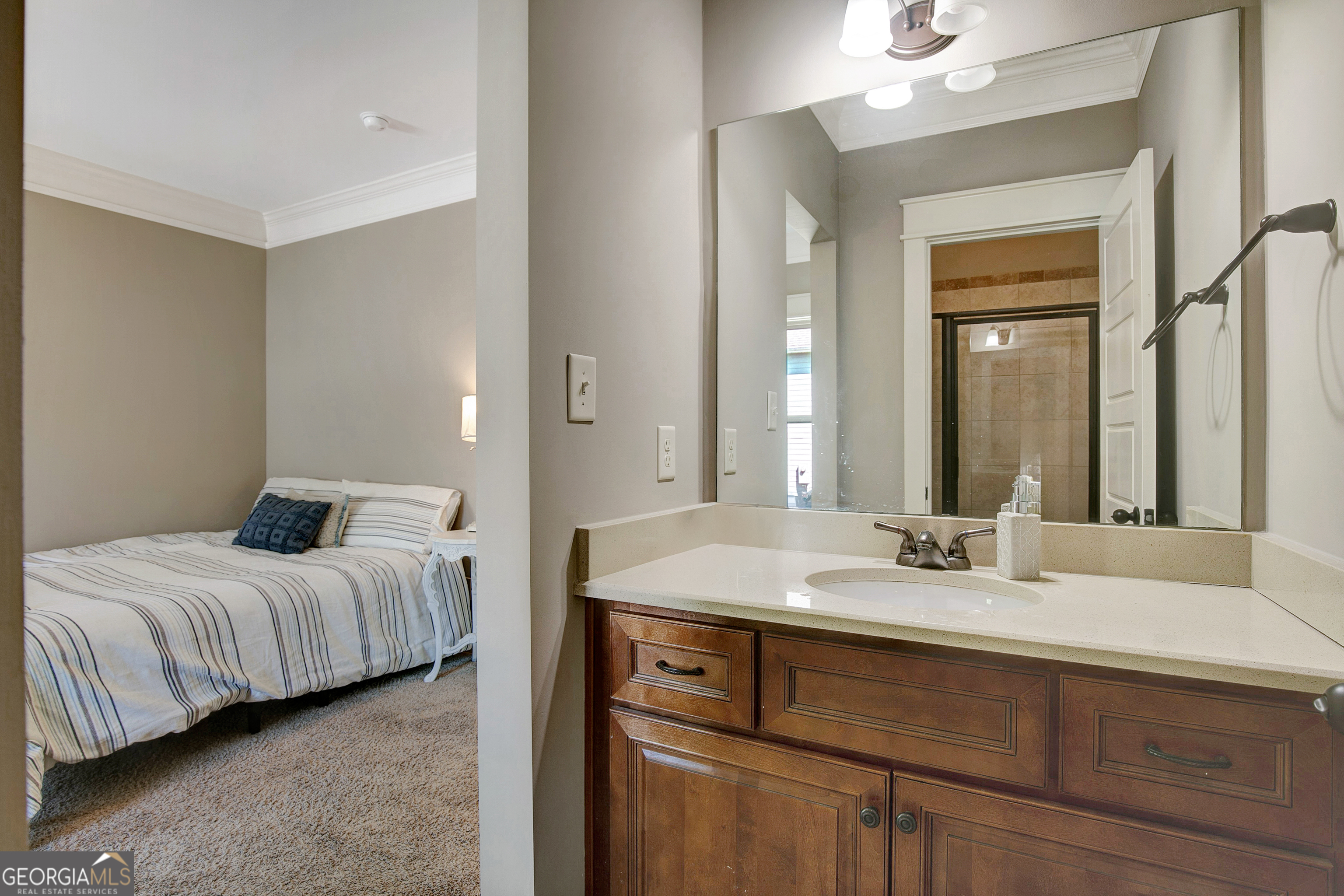 137 Kenmare Row Tyrone, GA 30290 - Photo 36 of 54 a bedroom with a bed and a mirror