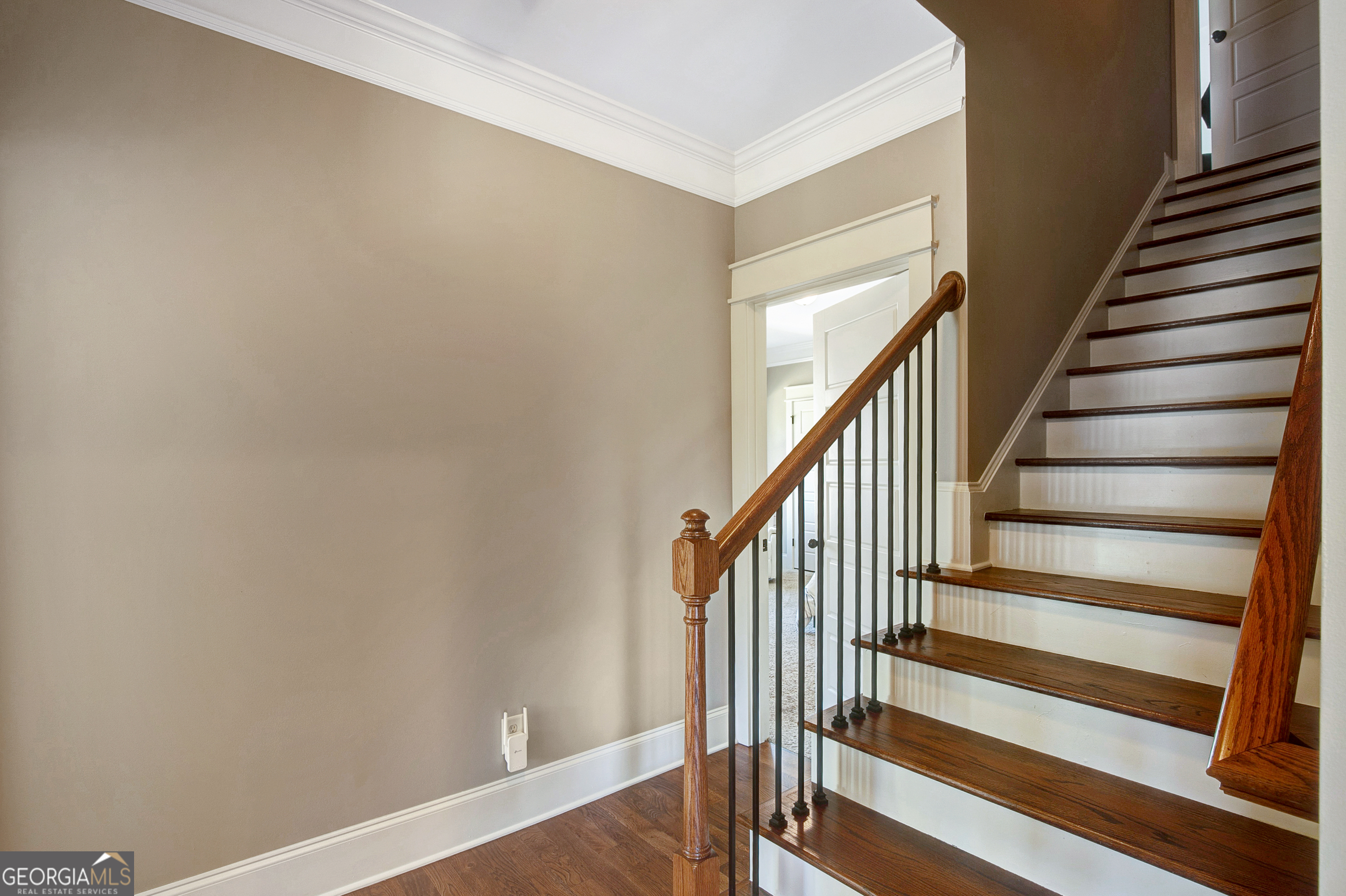 137 Kenmare Row Tyrone, GA 30290 - Photo 39 of 54 a view of staircase with wooden floor and white walls