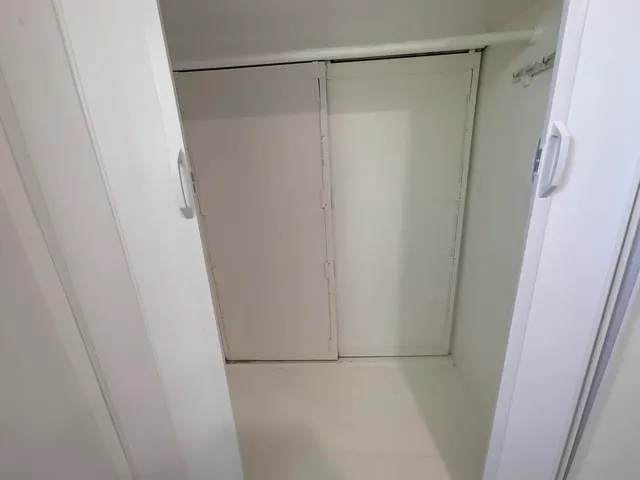 a bathroom with a glass shower door