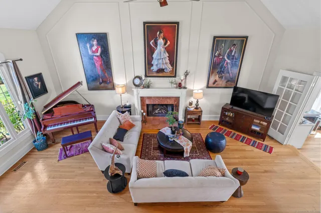 a living room with furniture and a fireplace