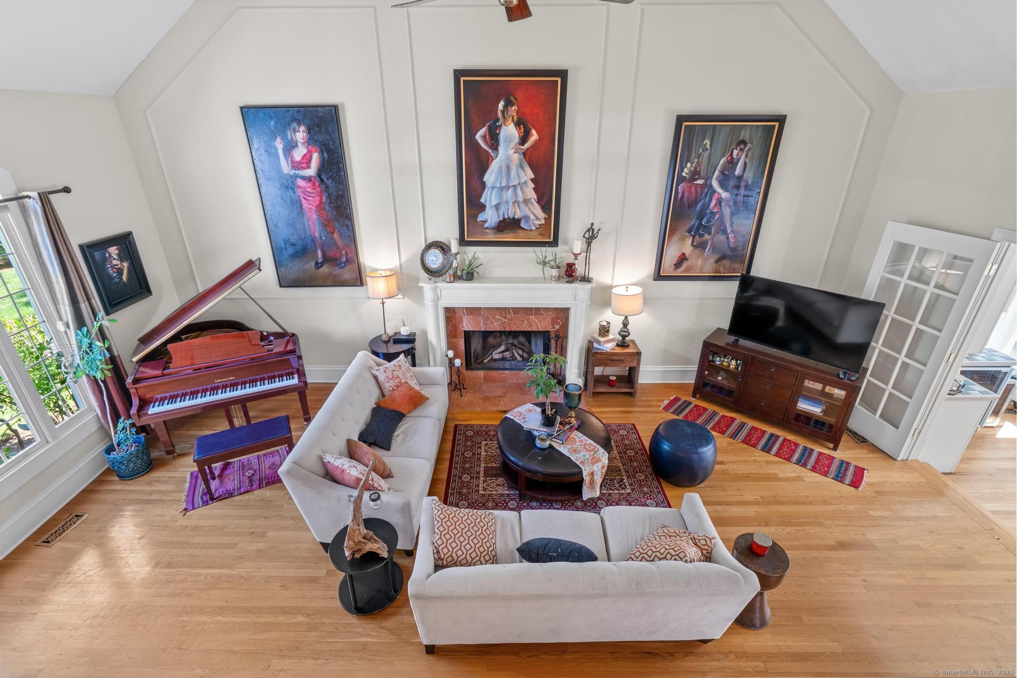 13 Orchard Hill Road Norwalk, CT 06851 - Photo 11 of 40 a living room with furniture and a fireplace