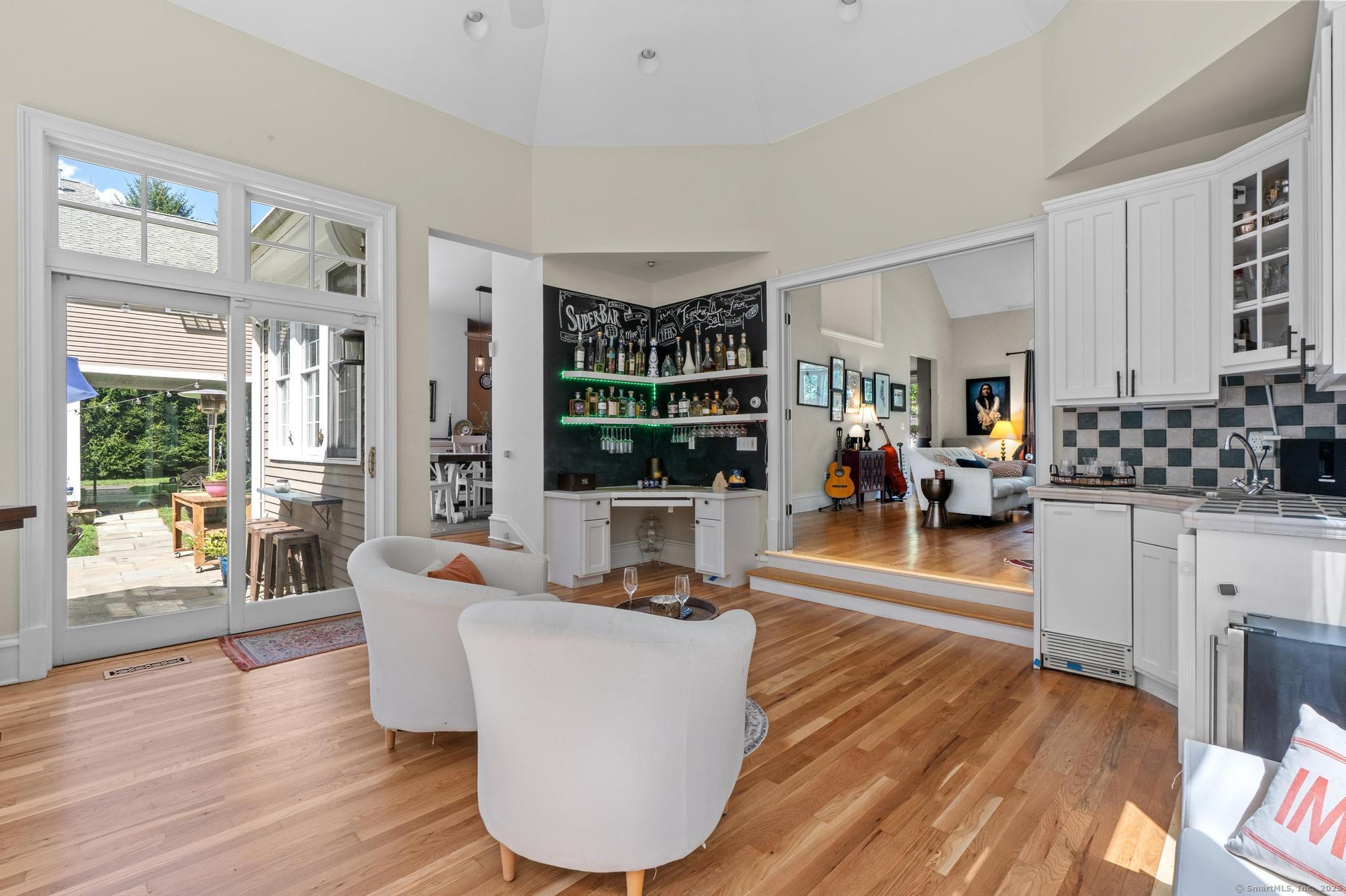 13 Orchard Hill Road Norwalk, CT 06851 - Photo 13 of 40 a living room with furniture a wooden floor and a large window