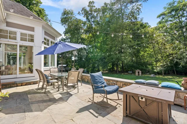 an outdoor space with patio and white umbrellas