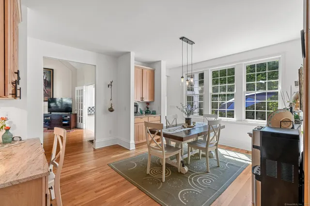 a view of a dining room with furniture window and outside view