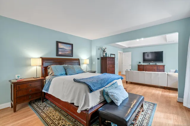 a bedroom with a bed and a couch