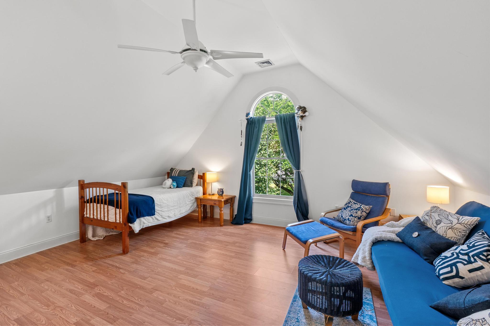 13 Orchard Hill Road Norwalk, CT 06851 - Photo 26 of 40 a bedroom with furniture and a window