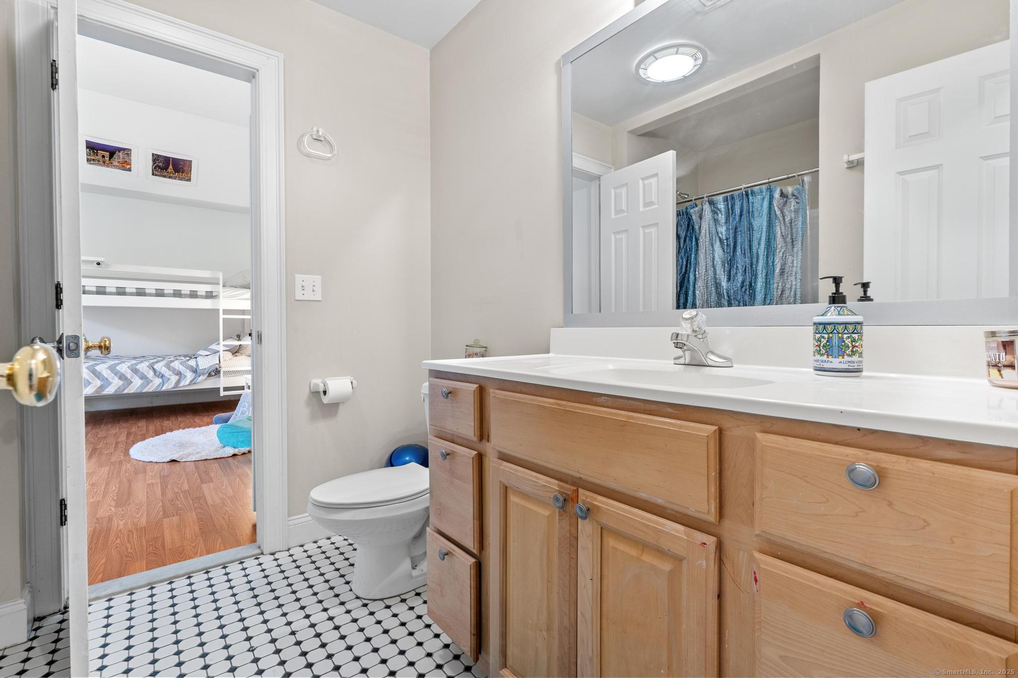 13 Orchard Hill Road Norwalk, CT 06851 - Photo 27 of 40 a bathroom with a sink toilet and a mirror