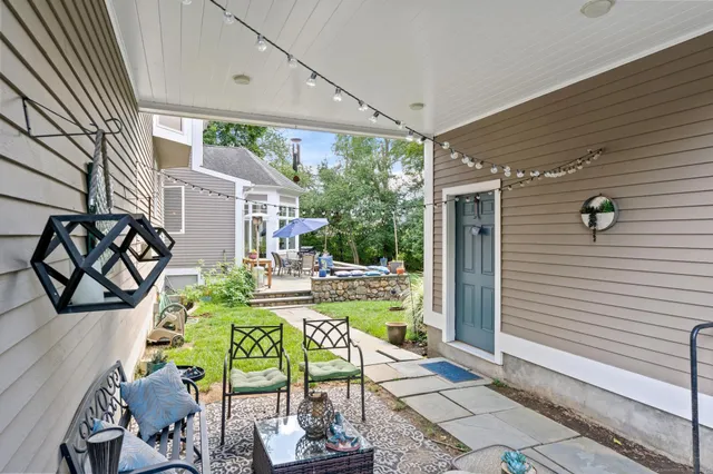 a view of an outdoor dining space with a patio