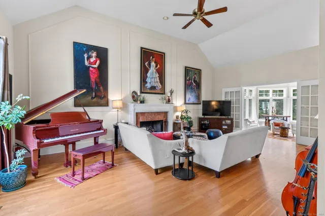 a living room with furniture and a fireplace
