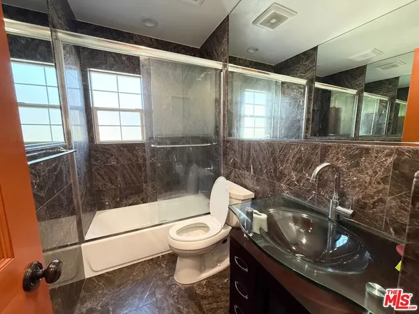 a bathroom with a sink and a toilet