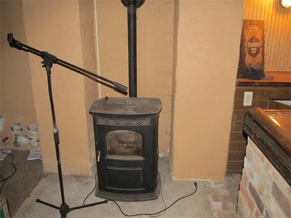 597 Amostown Road West Springfield, MA 01089 - Photo 4 of 7 a living room with a fireplace furniture and a potted plant