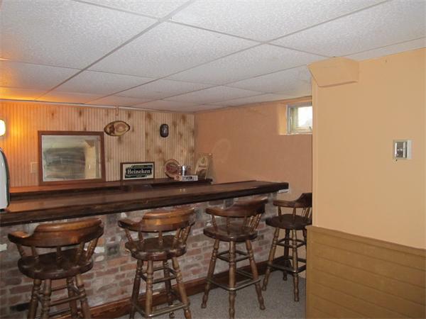 597 Amostown Road West Springfield, MA 01089 - Photo 5 of 7 a view of a dining room with furniture and wooden floor