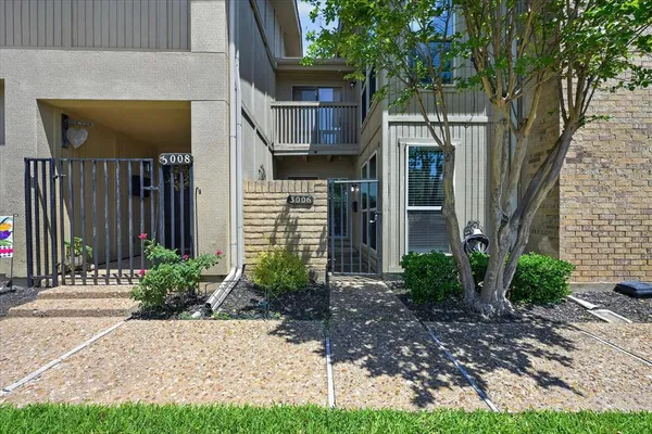 a view of a house with a garden