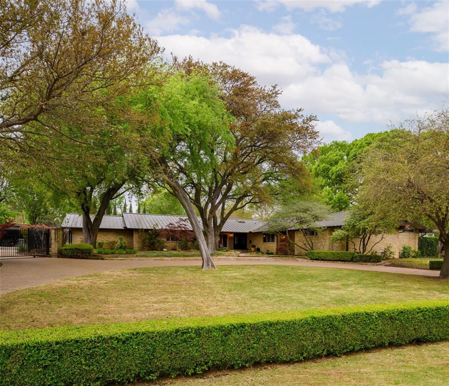 11323 East Ricks Circle Dallas, TX 75230 - Photo 1 of 1 a view of swimming pool with lawn chairs and plants