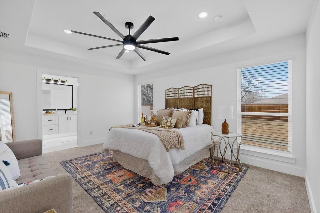 101 Boone Street Edgewood, TX 75117 - Photo 20 of 40 a bedroom with a large bed and a window