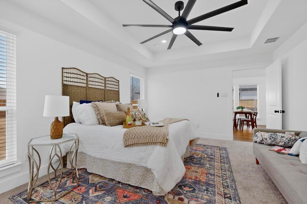 101 Boone Street Edgewood, TX 75117 - Photo 21 of 40 a bedroom with furniture and wooden floor