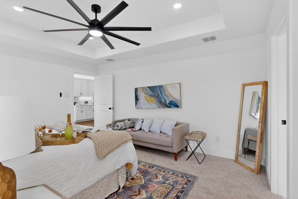 101 Boone Street Edgewood, TX 75117 - Photo 22 of 40 a living room with furniture and a ceiling fan