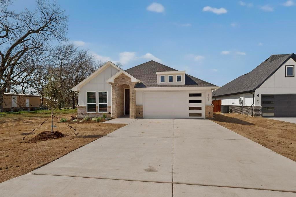 101 Boone Street Edgewood, TX 75117 - Photo 3 of 40 a front view of a house with a yard