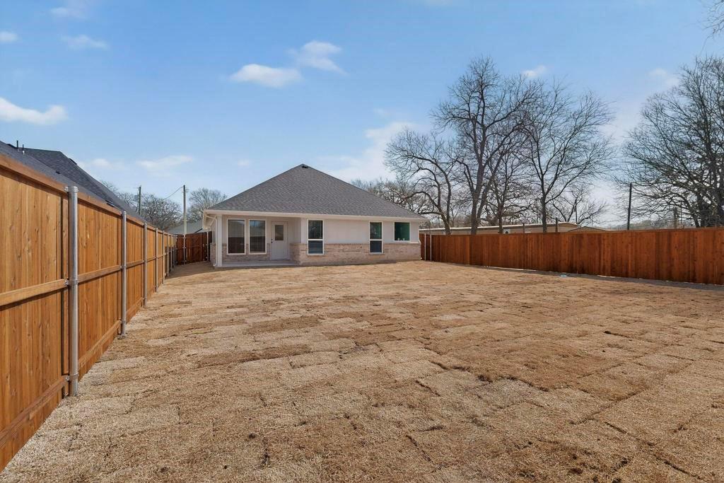 101 Boone Street Edgewood, TX 75117 - Photo 37 of 40 a yard with wooden fence