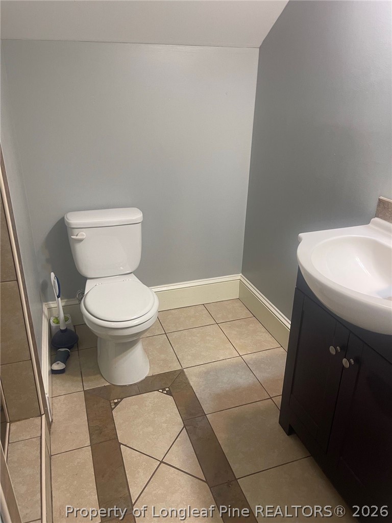 2515 Fort Bragg Road Fayetteville, NC 28303 - Photo 21 of 23 a bathroom with a sink and a toilet