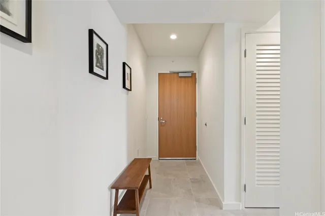 a bedroom with a bed and a chair in it