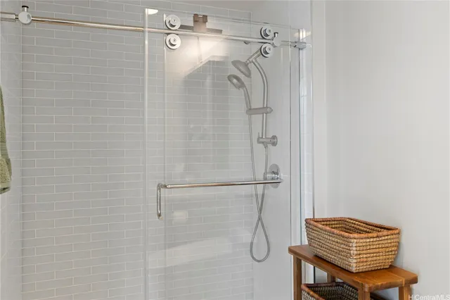 a bedroom with a bed and a lamp on table