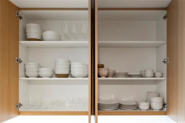 a balcony with table and chairs