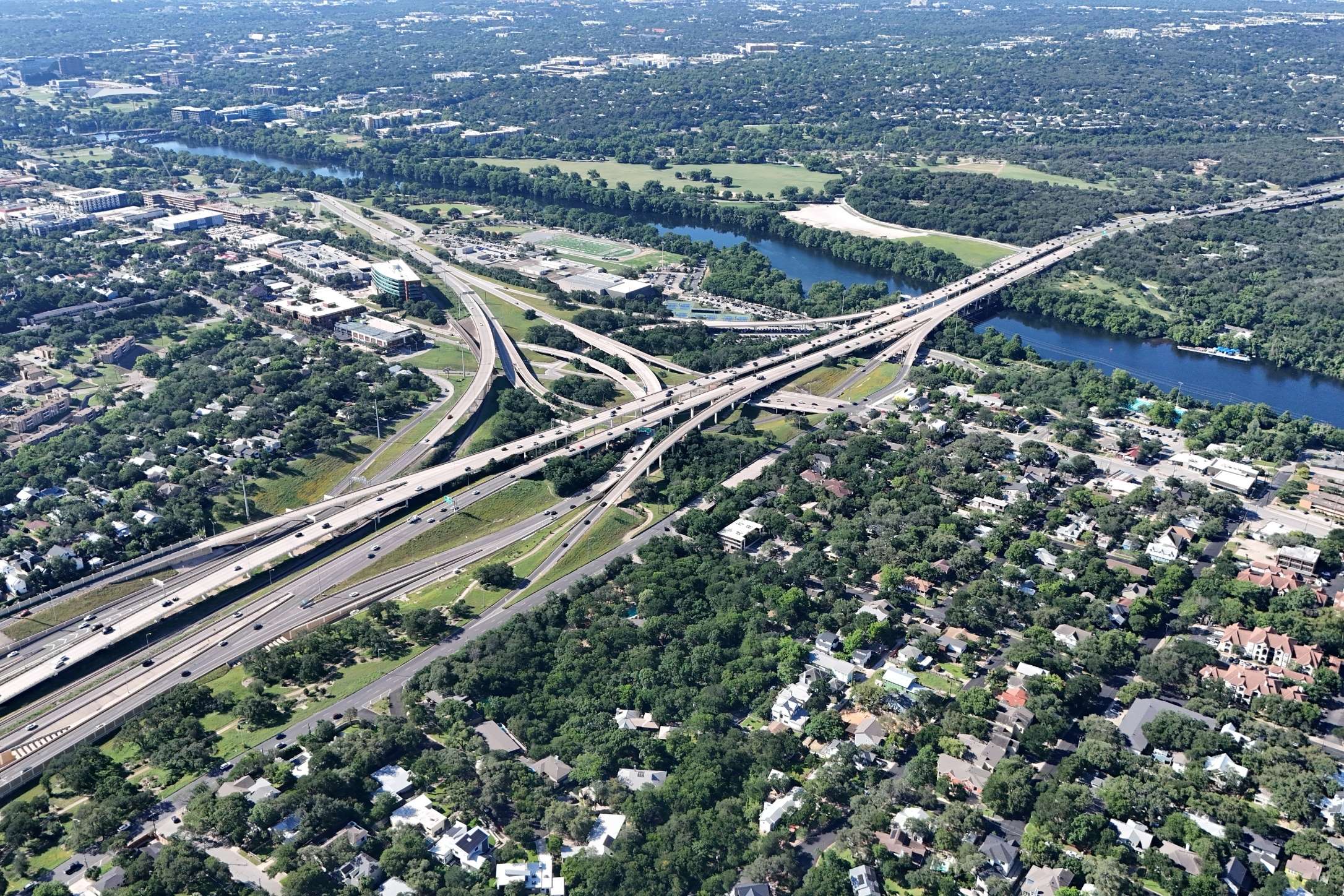 2208 Enfield Road, Unit 10500 Austin, TX 78703 - Photo 10 of 34 Aerial depiction of a sprawling urban landscape featuring a complex highway interchange