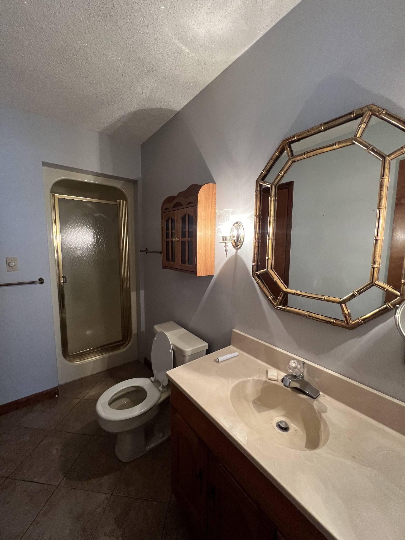 13254 Galen Road Lafayette, TN 37083 - Photo 17 of 19 a bathroom with a sink mirror and toilet