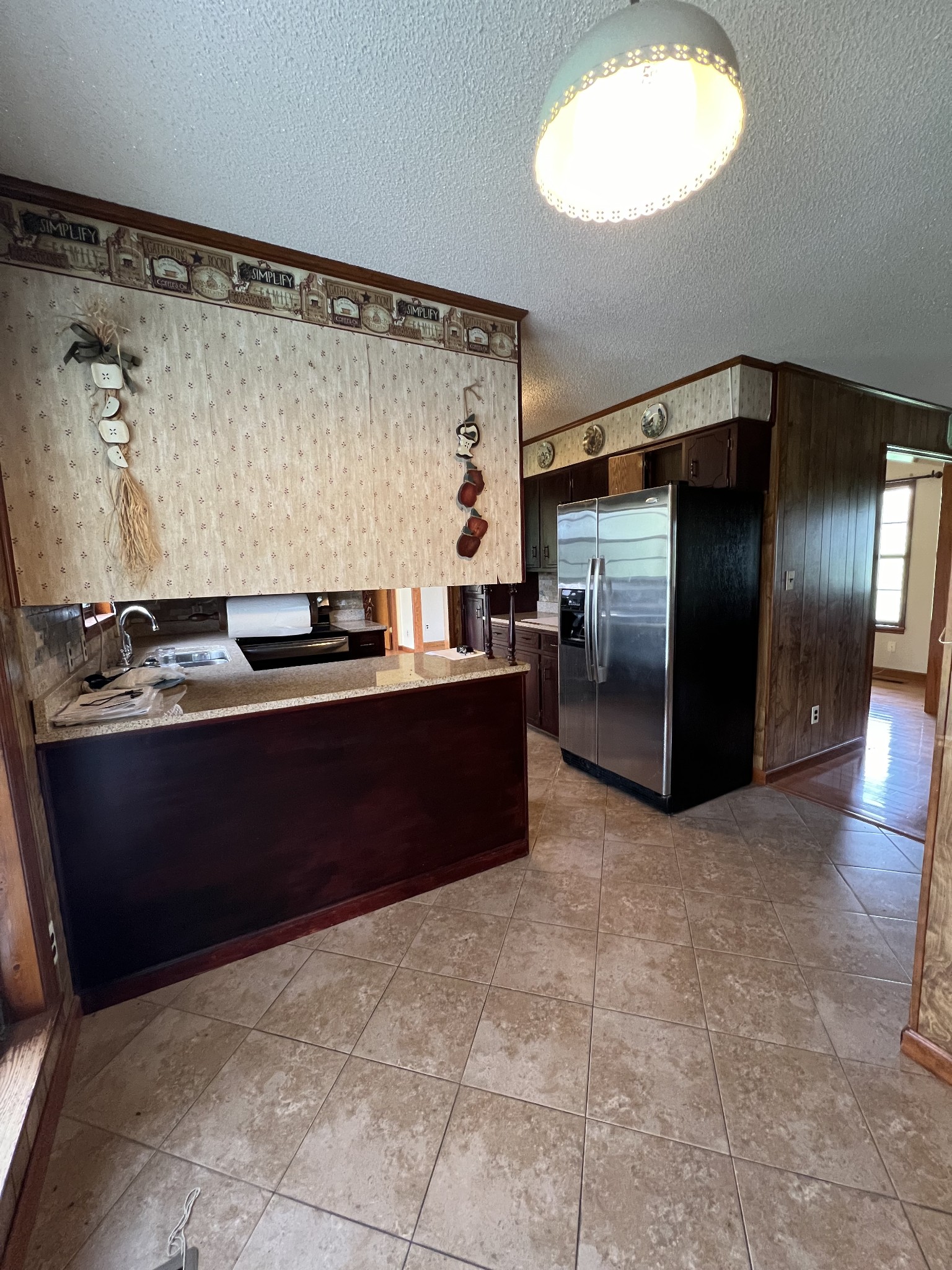 13254 Galen Road Lafayette, TN 37083 - Photo 4 of 19 a kitchen with stainless steel appliances granite countertop a refrigerator and a stove