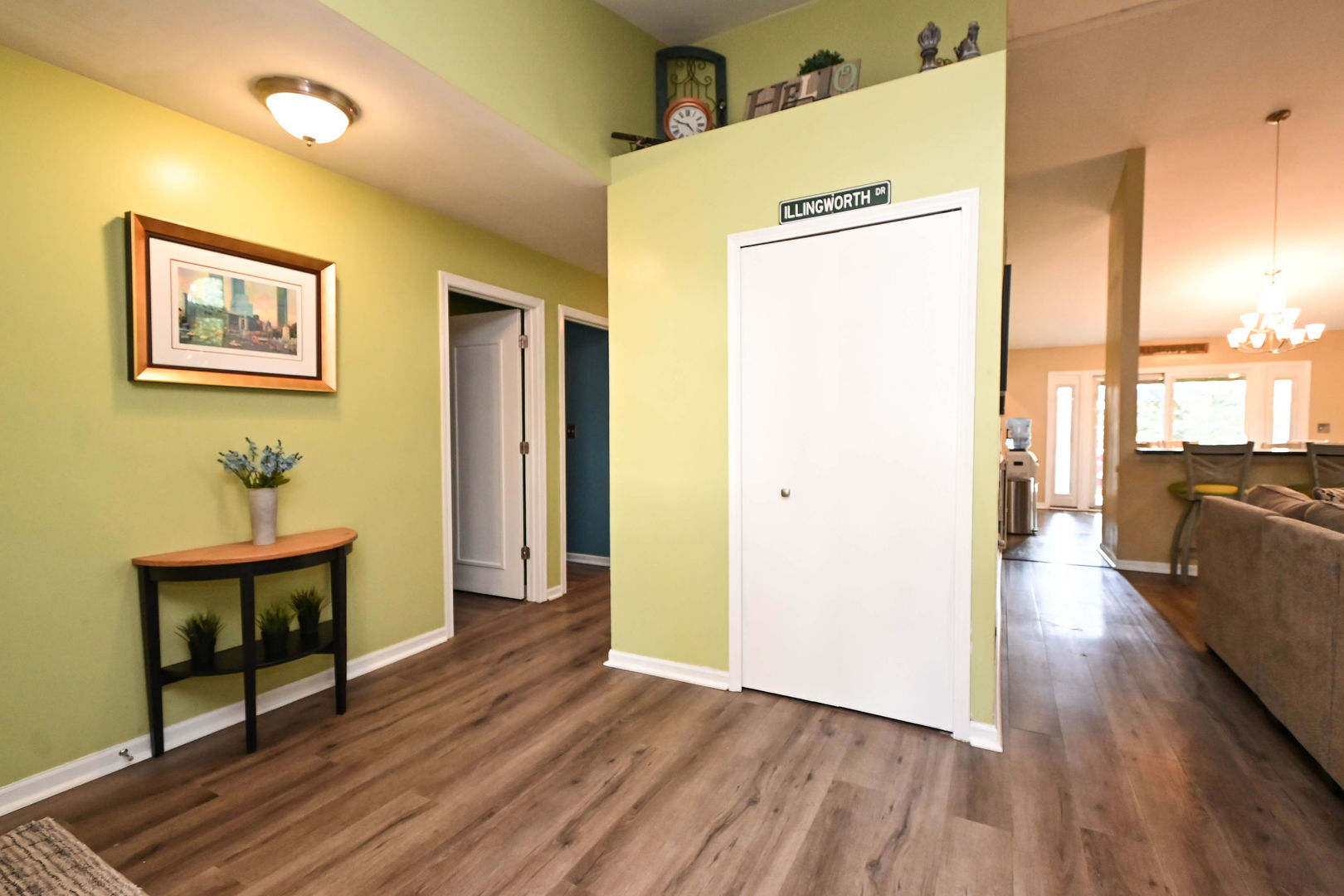 1333 Regency Lane Round Lake, IL 60073 - Photo 6 of 31 a view of a hallway view with wooden floor and furniture