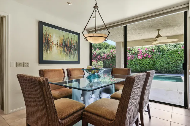 a view of a dining room with furniture window and outside view